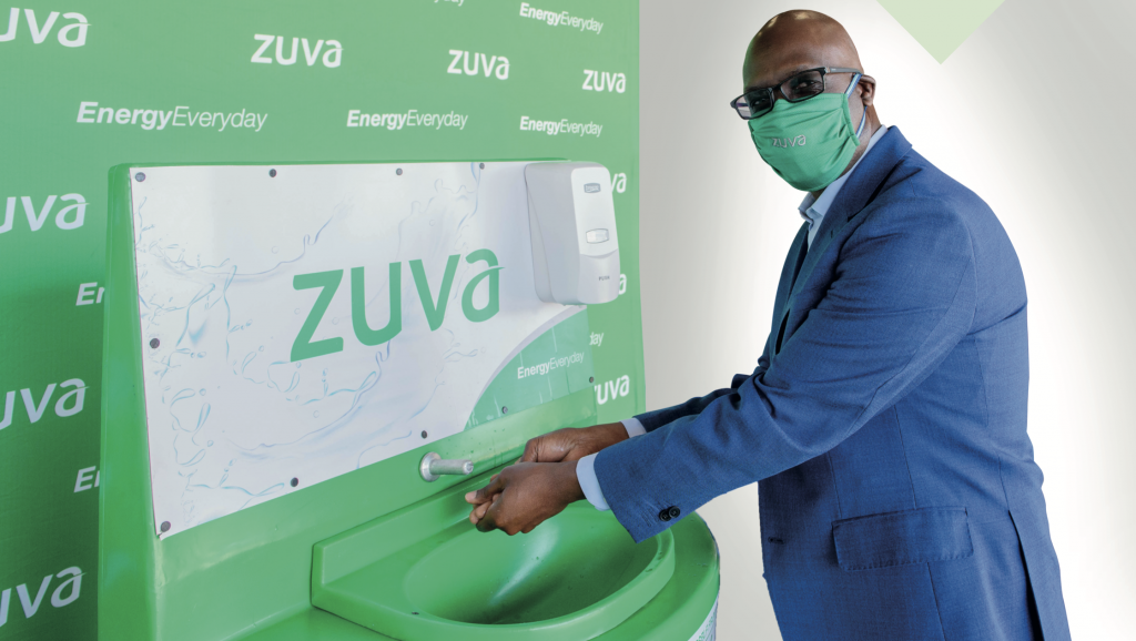  Zuva Petroleum Chief Executive Officer Mr Bethwell Gumbo demonstrates use of the hand-washing station.