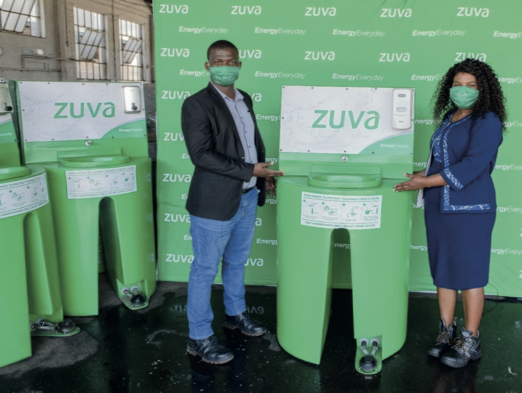 Commercial Manager Mr M Ndlovu hands over a Hand washing Station to Mrs Nyaruviro LPG Reseller at Zuva Gas Westlea