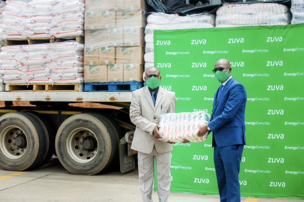 Mr B. Gumbo Zuva Petroleum CEO hands over food hampers and PPE to the Chief Director in the Ministry of Public Service Labour and Social welfare Mr C. Matorera