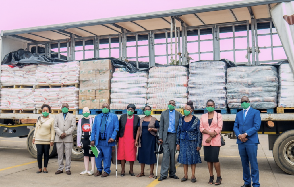 Mr Gumbo and Mr Matorera pose for a picture with some of the representatives from the beneficiary homes. Mr Gumbo and Mr Matorera pose for a picture with some of the representatives from the beneficiary homes.