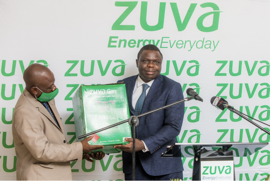 Zuva Petroleum Corporate Services Executive Mr Phillip Vanhuvaone hands over a token of appreciation to the Chief Director, Mr Clifford Matorera.